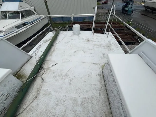 Slide: The Image of 1989 Maritime 340 Trawler deck with railing and equipment, docked at a marina. - 38
