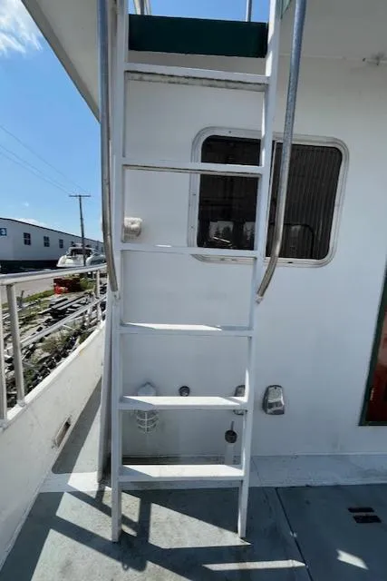 Slide: The Image of 1989 Maritime 340 Trawler ladder and window detail on deck. - 4