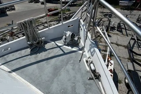 Slide: The Image of 1989 Maritime 340 Trawler deck with ropes and railing in a marina setting. - 5