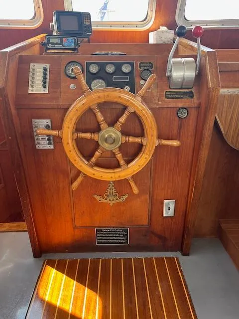 Slide: The Image of 1989 Maritime 340 Trawler helm with wooden wheel and navigation instruments. - 9