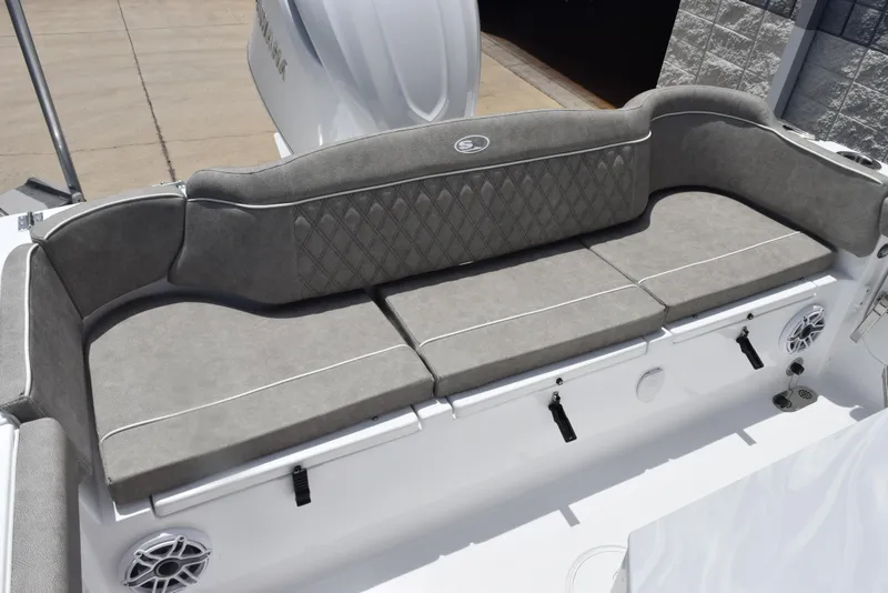 Slide: The Image of 2026 Sea Hunt Ultra 255 SE boat with cushioned seating and modern design. - 10