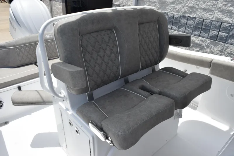 Slide: The Image of 2026 Sea Hunt Ultra 255 SE boat seats with gray upholstery and armrests. - 13