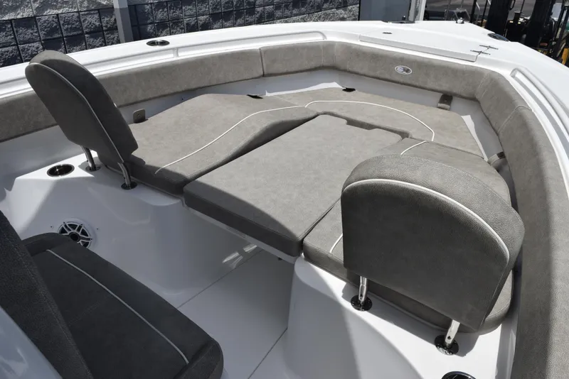 Slide: The Image of 2026 Sea Hunt Ultra 255 SE boat interior with cushioned seating and modern design. - 14