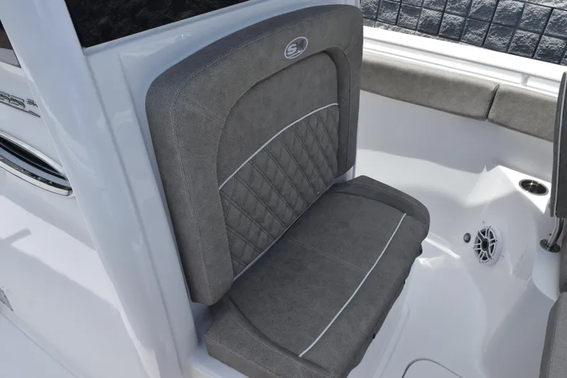 Slide: The Image of 2026 Sea Hunt Ultra 255 SE boat seat with gray upholstery and quilted design. - 15