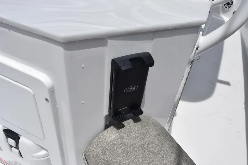 Slide: The Image of 2026 Sea Hunt Ultra 255 SE boat console with mounted accessory holder. - 17