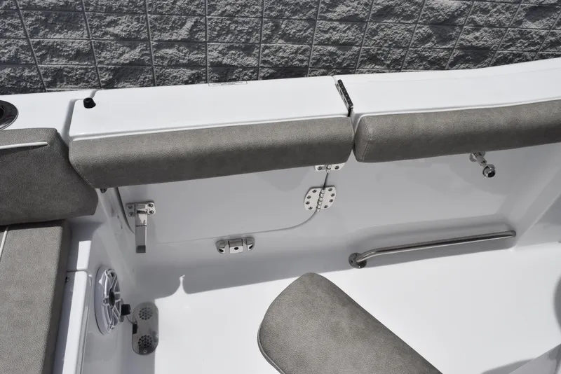 Slide: The Image of 2026 Sea Hunt Ultra 255 SE boat interior with cushioned seating and sleek design. - 19