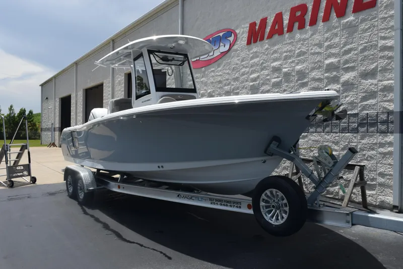 Slide: The Image of 2026 Sea Hunt Ultra 255 SE boat on trailer outside marine dealership. - 2
