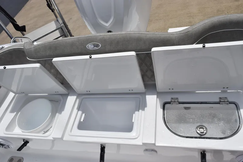 Slide: The Image of 2026 Sea Hunt Ultra 255 SE boat storage compartments, open and ready for use. - 20
