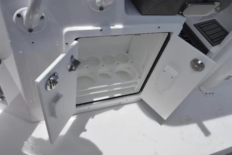 Slide: The Image of Open storage compartment on 2026 Sea Hunt Ultra 255 SE boat. - 23