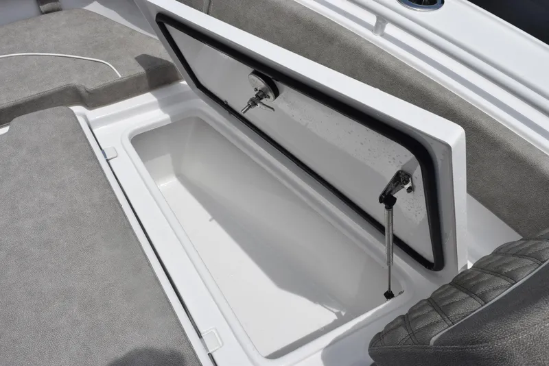 Slide: The Image of Open storage compartment on 2026 Sea Hunt Ultra 255 SE boat. - 24