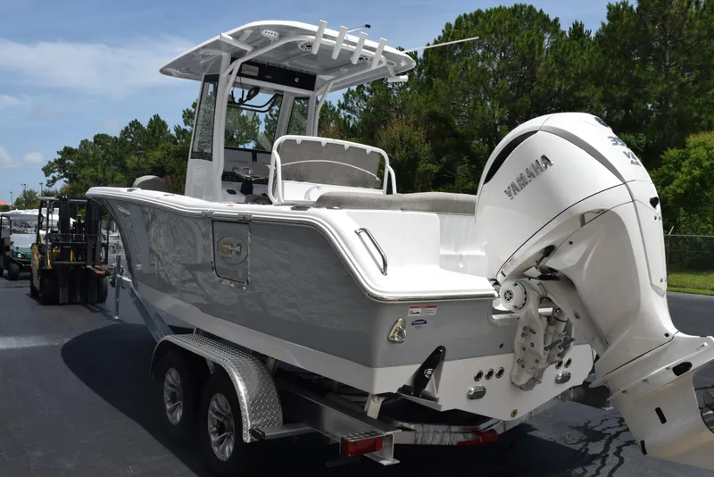 Slide: The Image of 2026 Sea Hunt Ultra 255 SE boat with Yamaha outboard motor on trailer. - 6