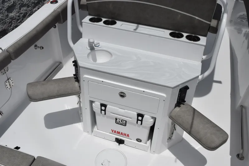 Slide: The Image of Interior of 2026 Sea Hunt Ultra 255 SE boat with seating and storage features. - 9