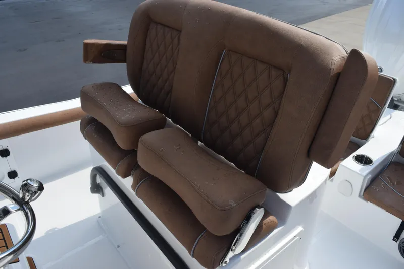 Slide: The Image of 2026 Sea Hunt BX 25 FS boat seat with brown cushioned upholstery. - 12