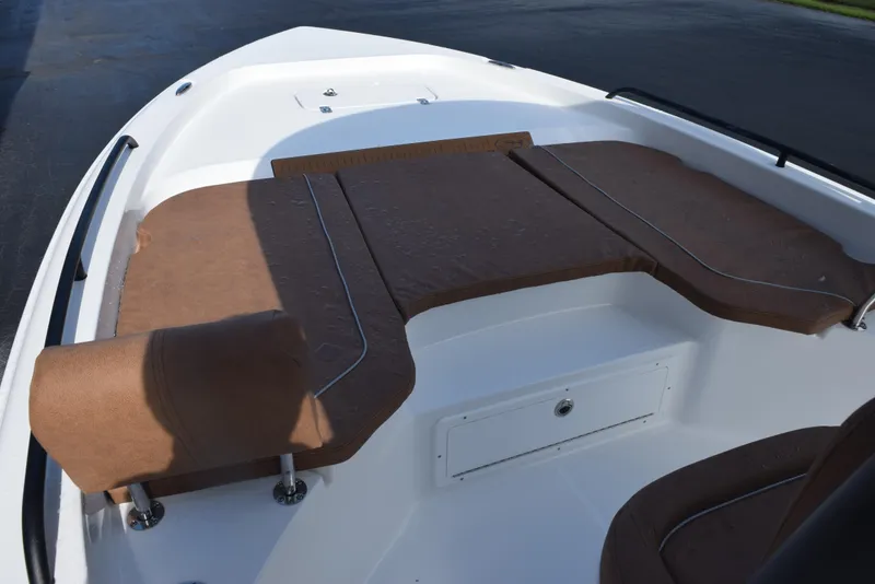 Slide: The Image of 2026 Sea Hunt BX 25 FS boat interior with brown cushioned seating. - 13
