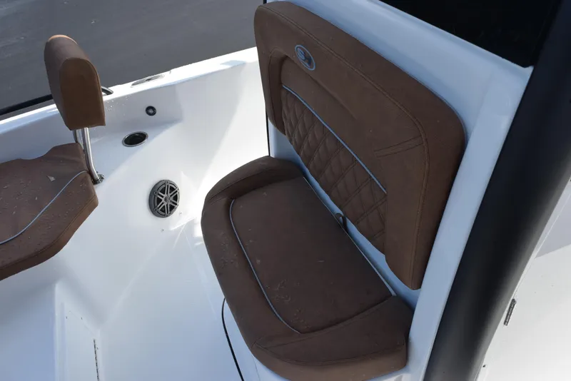 Slide: The Image of 2026 Sea Hunt BX 25 FS boat interior with brown cushioned seating. - 14