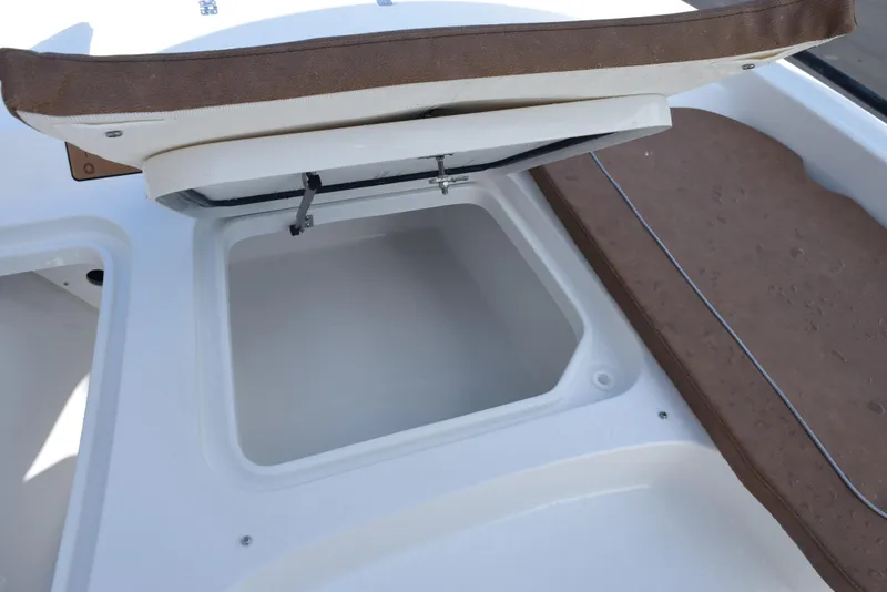 Slide: The Image of Open storage compartment on 2026 Sea Hunt BX 25 FS boat. - 17