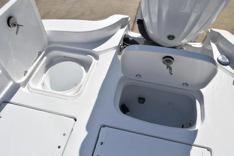 Slide: The Image of 2026 Sea Hunt BX 25 FS boat deck with storage compartments and engine mount. - 25