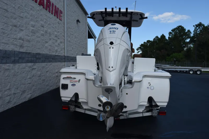 Slide: The Image of 2026 Sea Hunt BX 25 FS boat with powerful outboard motor, parked outdoors. - 5
