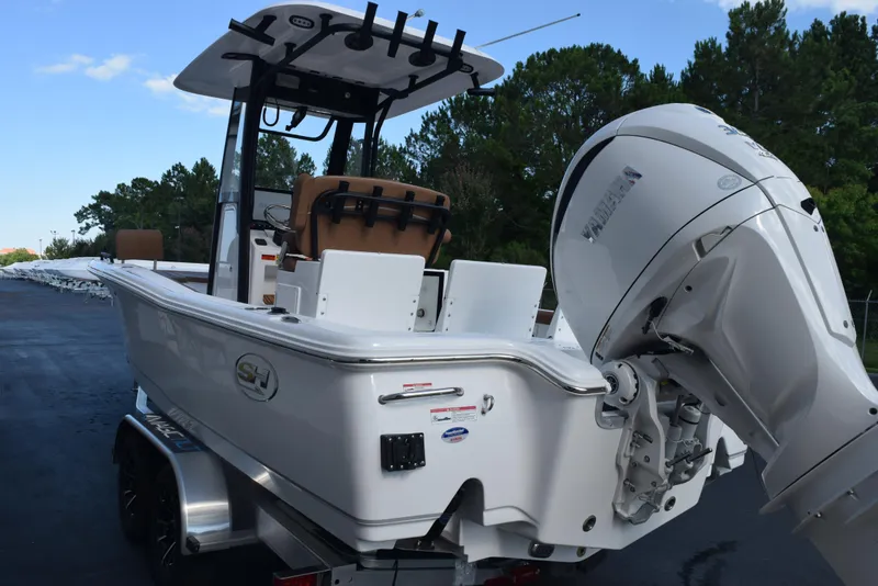 Slide: The Image of 2026 Sea Hunt BX 25 FS boat with Yamaha outboard motor, parked on a trailer. - 6