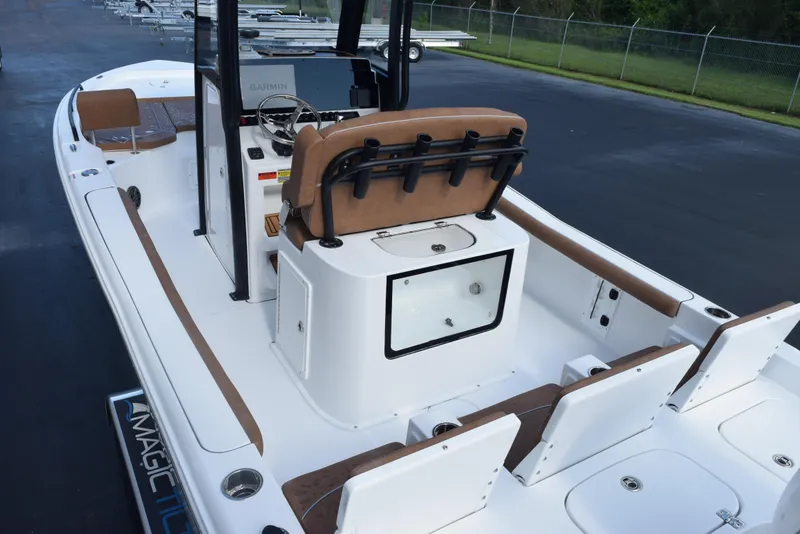 Slide: The Image of 2026 Sea Hunt BX 25 FS boat interior with seating and console, parked on pavement. - 8