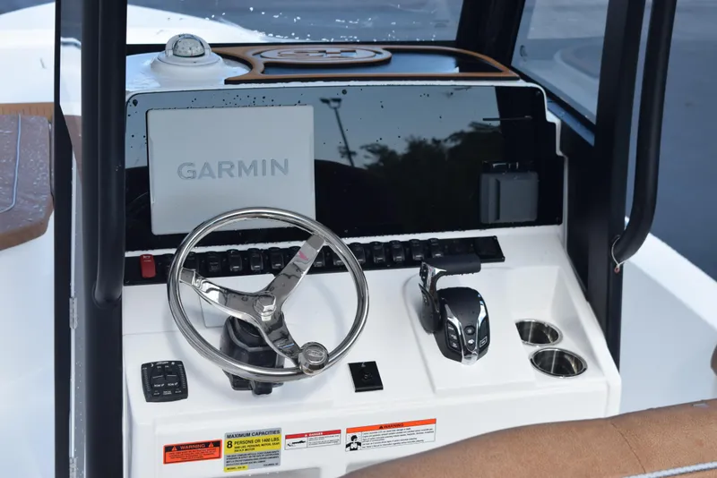 Slide: The Image of 2026 Sea Hunt BX 25 FS boat console with Garmin display and steering wheel. - 9