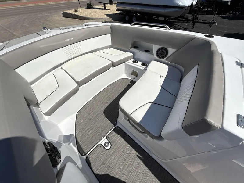 Slide: The Image of 2022 Glastron GTD 245 boat interior with spacious seating and modern design. - 11