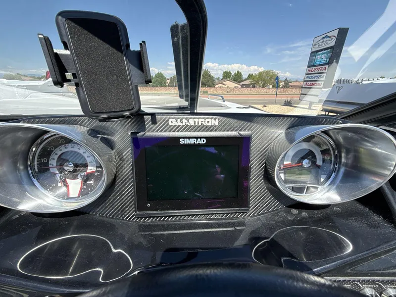 Slide: The Image of Dashboard of 2022 Glastron GTD 245 boat with Simrad display and gauges. - 15