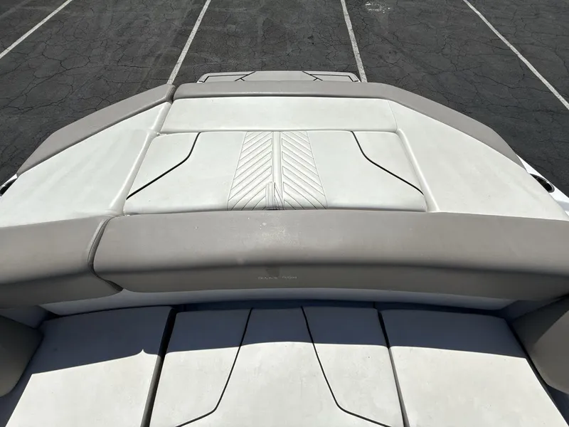 Slide: The Image of 2022 Glastron GTD 245 boat interior with cushioned seating and sleek design. - 19