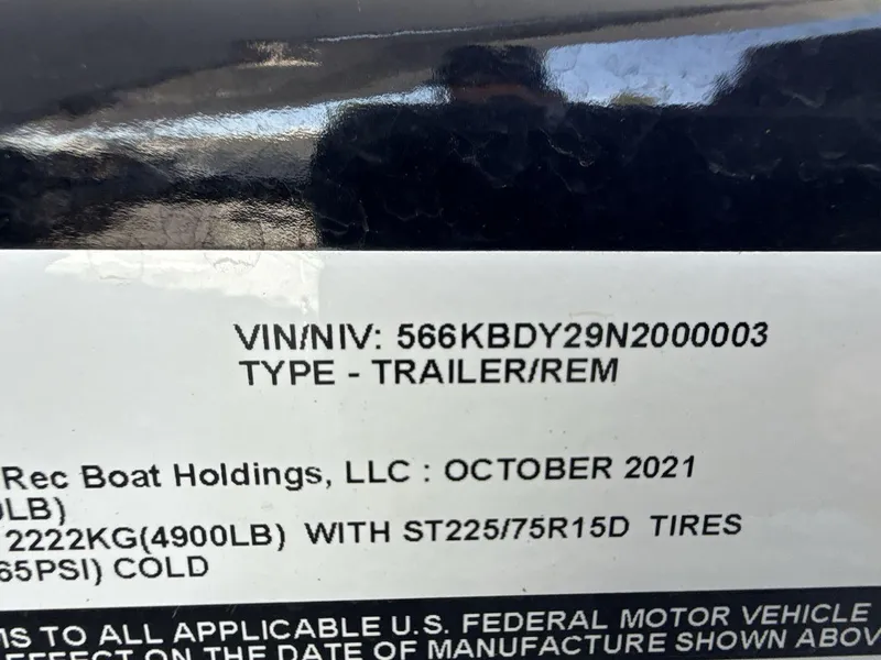 Slide: The Image of VIN label on a 2022 Glastron GTD 245 trailer, manufactured October 2021. - 28