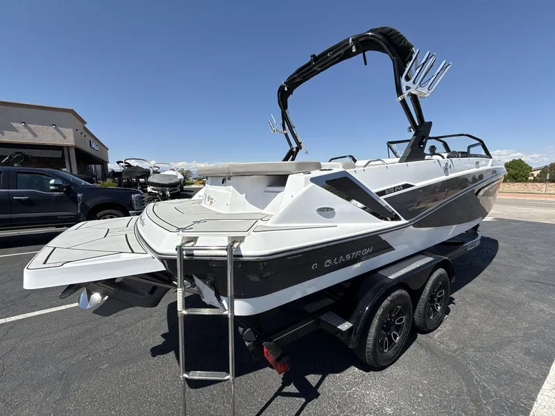 Slide: The Image of 2022 Glastron GTD 245 boat on trailer, featuring sleek design and modern amenities. - 5
