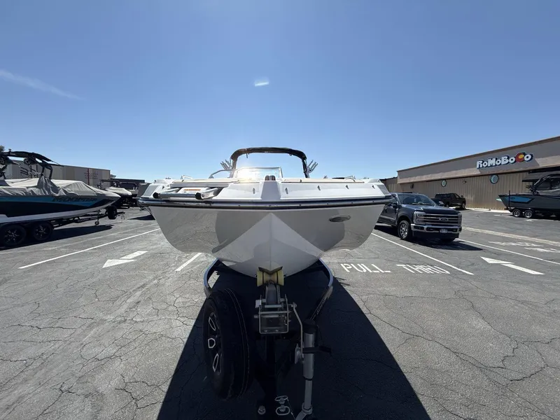 Slide: The Image of 2022 Glastron GTD 245 boat on trailer in parking lot, sunny day. - 8