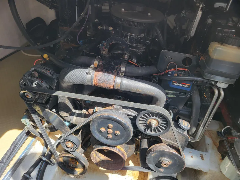 Slide: The Image of Engine compartment of a 2003 Larson 310 boat, showing belts and pulleys. - 37