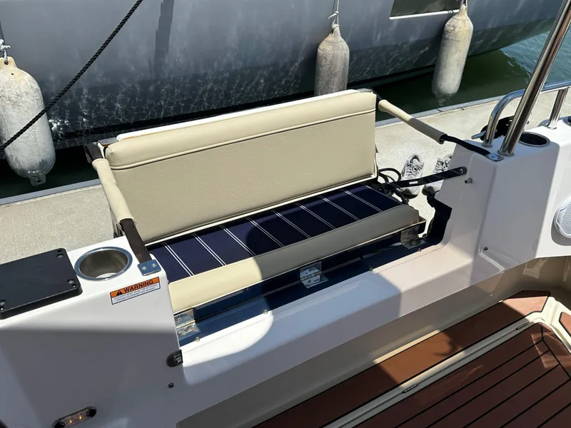 Slide: The Image of 2023 Ranger Tugs R-31 CB boat seat with solar panel, docked with fenders. - 19
