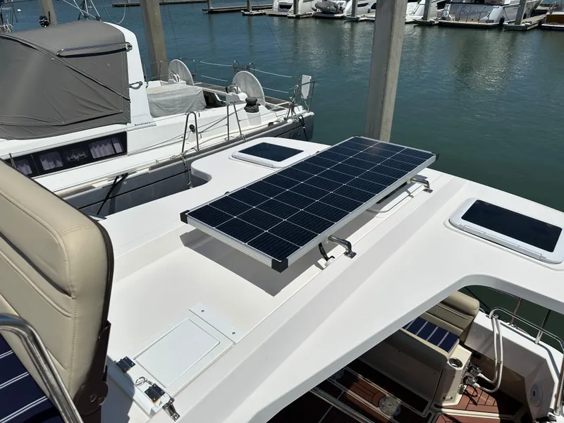 Slide: The Image of 2023 Ranger Tugs R-31 CB with solar panel on deck, docked at marina. - 30