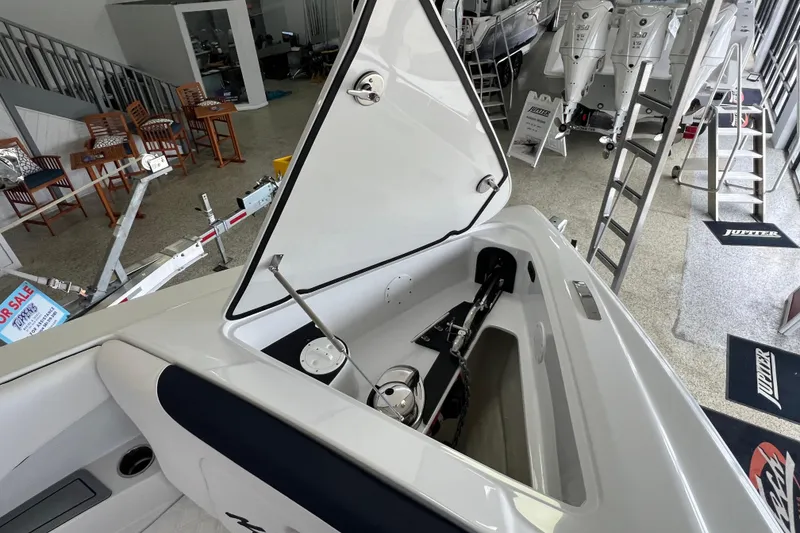 Slide: The Image of 2026 Nor-Tech 340 Sport boat interior with white seating and modern design. - 11