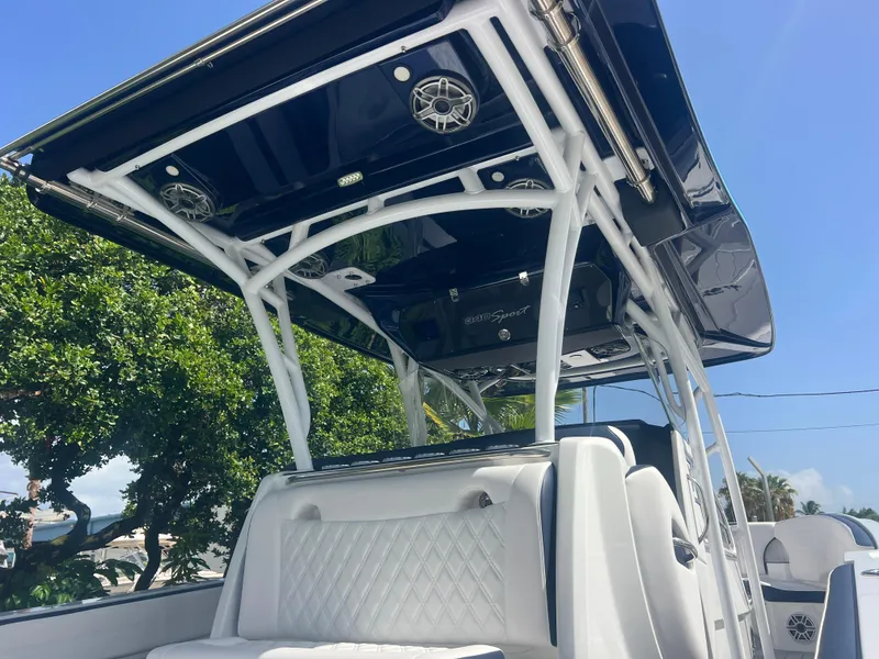 Slide: The Image of 2026 Nor-Tech 340 Sport boat in a showroom on a trailer. - 2