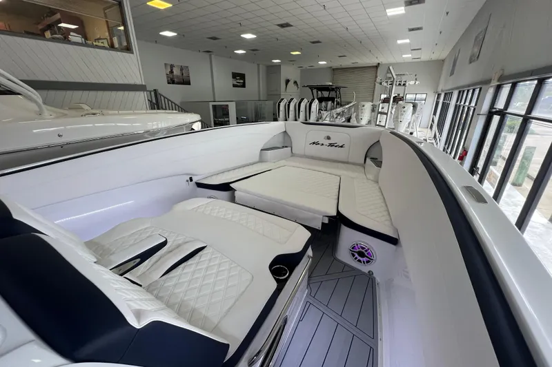 Slide: The Image of Luxurious interior of 2026 Nor-Tech 340 Sport boat with elegant seating and custom flooring. - 26