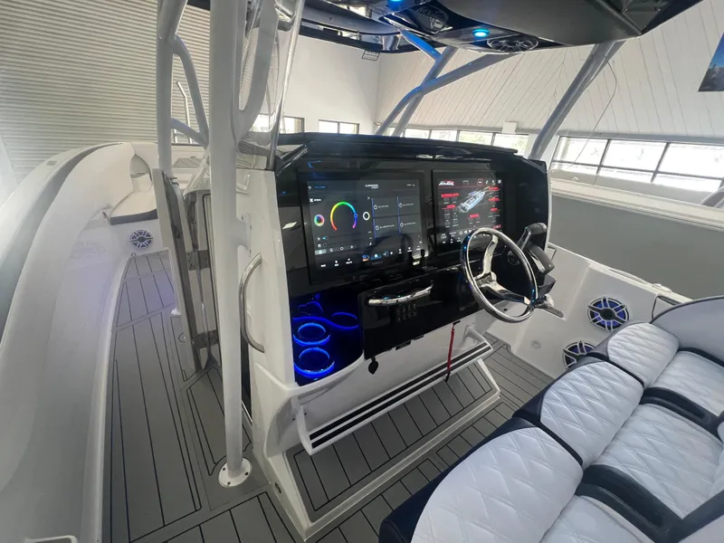 Slide: The Image of Luxurious interior of 2026 Nor-Tech 340 Sport boat with white seating and table. - 5