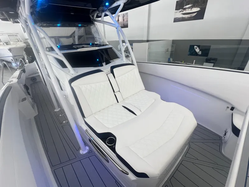 Slide: The Image of 2026 Nor-Tech 340 Sport boat cockpit with advanced digital displays and luxurious seating. - 6