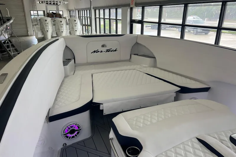 Slide: The Image of 2026 Nor-Tech 340 Sport boat cockpit with advanced navigation system and luxurious seating. - 9