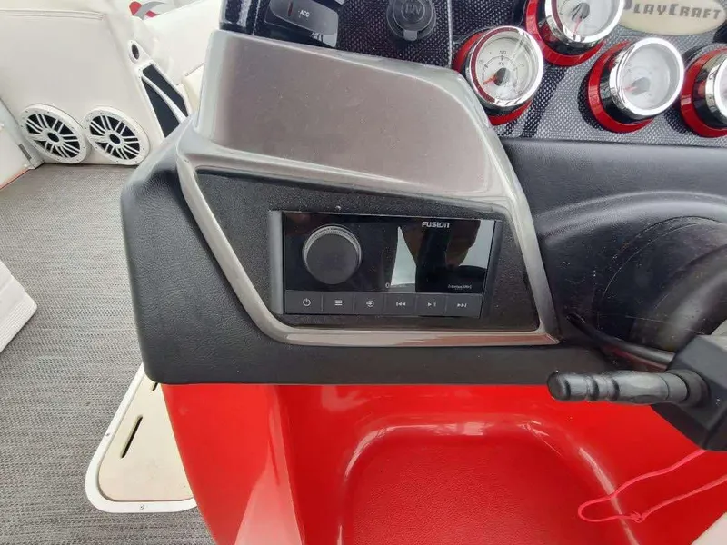 Slide: The Image of Control panel of 2017 PlayCraft 2600 X-treme boat with gauges and audio system. - 18