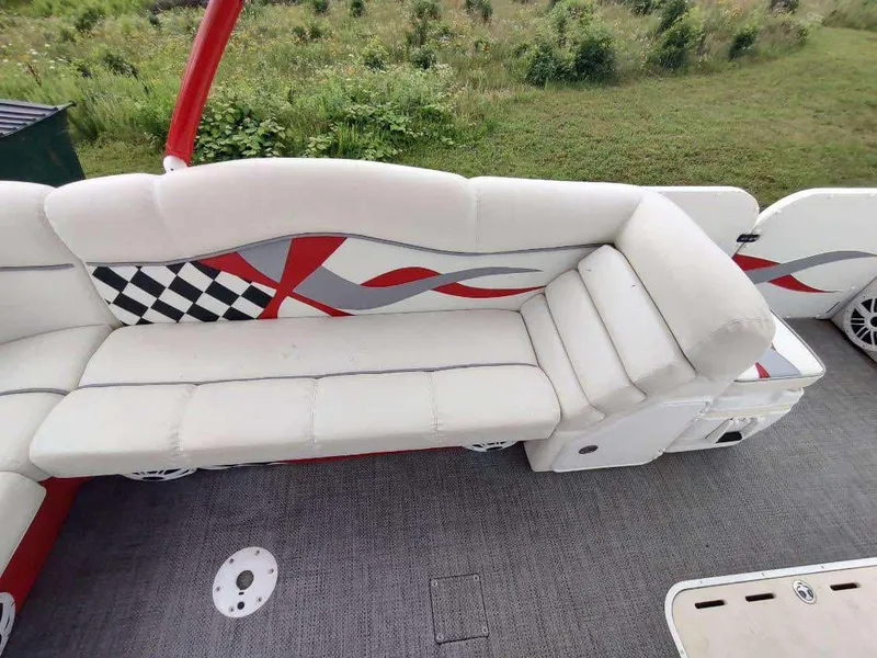 Slide: The Image of 2017 PlayCraft 2600 X-treme boat interior with white seating and checkered design. - 4