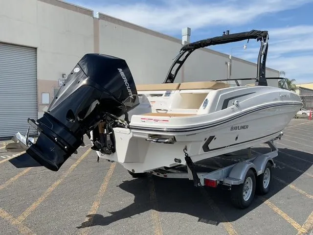 Slide: The Image of 2025 Bayliner VR6 Bowrider OB on trailer, featuring a powerful outboard motor. - 5