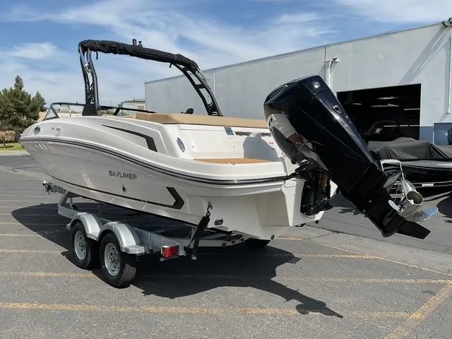 Slide: The Image of 2025 Bayliner VR6 Bowrider OB on trailer, parked outdoors. - 7