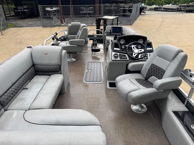 Slide: The Image of 2022 Ranger Reata 223FC pontoon boat on trailer at Boateka dealership. - 3