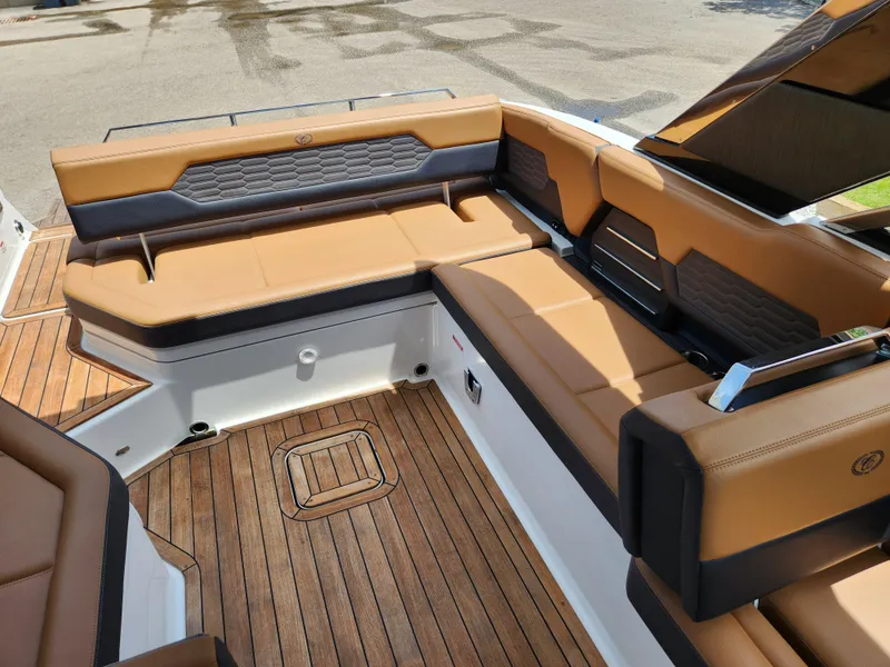 Slide: The Image of Luxurious seating on 2021 Cobalt A29 boat with teak flooring and tan upholstery. - 22