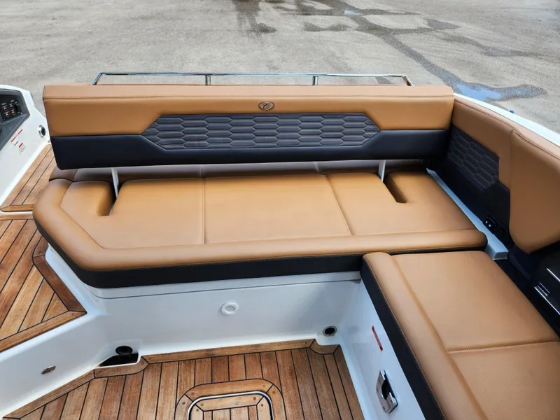 Slide: The Image of Luxurious seating on 2021 Cobalt A29 boat with tan and black upholstery. - 24