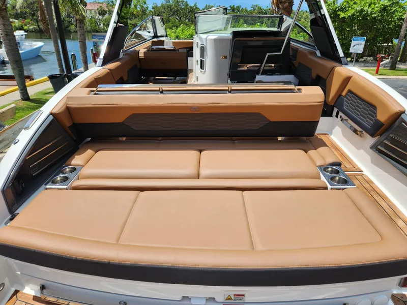 Slide: The Image of 2021 Cobalt A29 boat with luxurious tan seating and sleek design. - 6