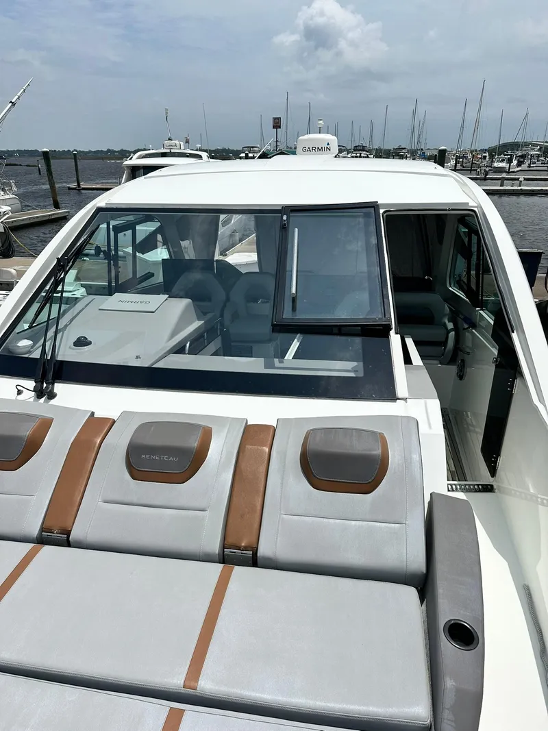 Slide: The Image of 2021 Beneteau GT 32 yacht with sleek design, docked at marina. - 13