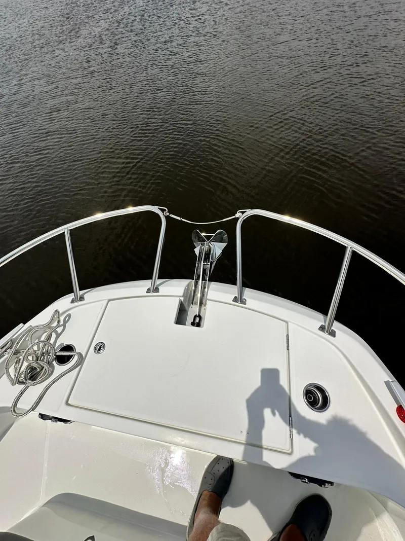 Slide: The Image of 2021 Beneteau GT 32 boat bow with railing and water view. - 18